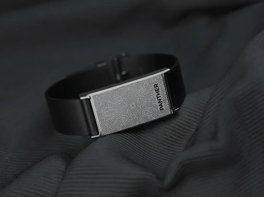 Panther Eclipse on a chestnut leather band, resting beside an automatic dress watch