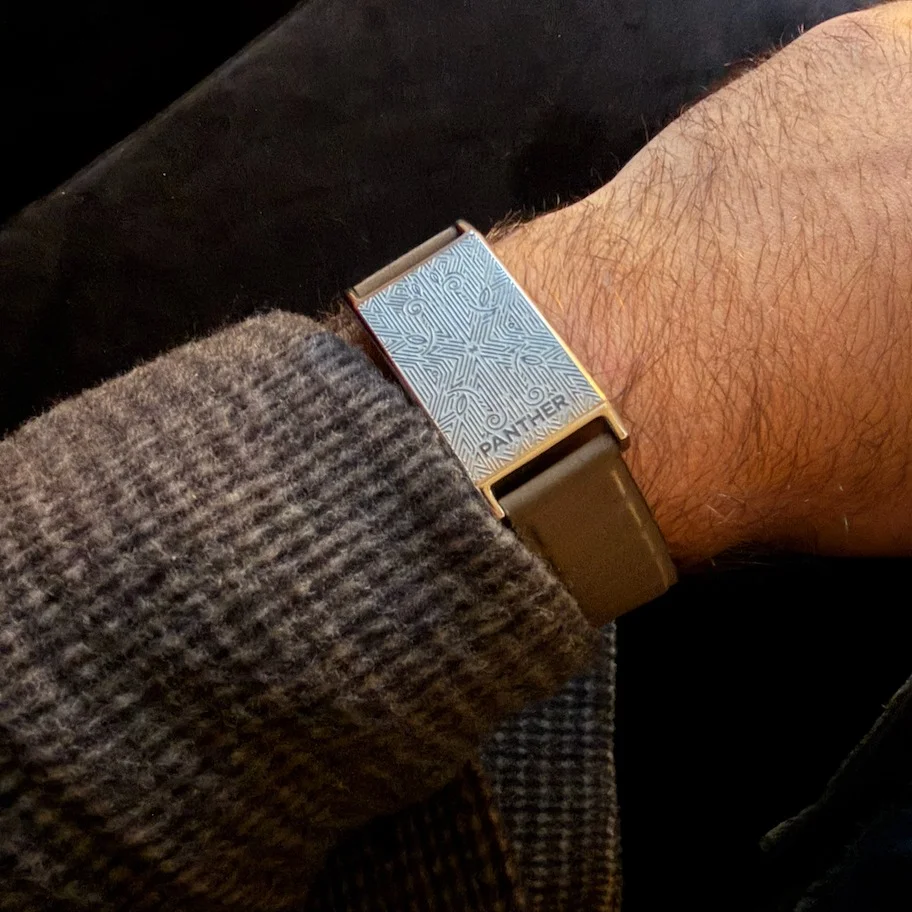 Panther Eclipse with engraved Deco face worn under a knit sweater cuff